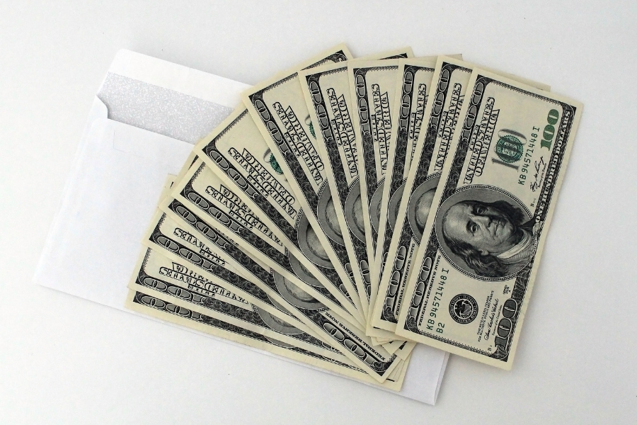 hundred dollar bills and envelope