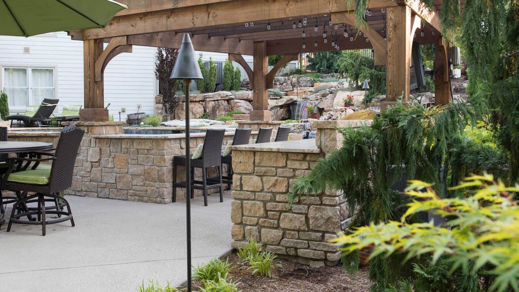 Outdoor lounge with bar and kitchen