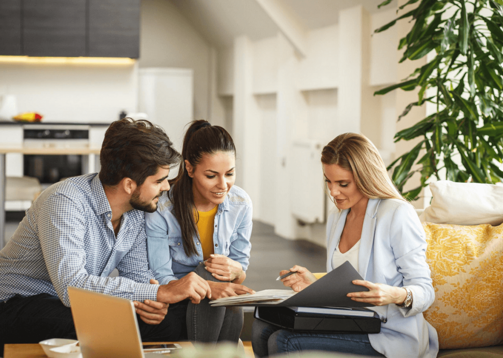 man and woman meeting with realtor