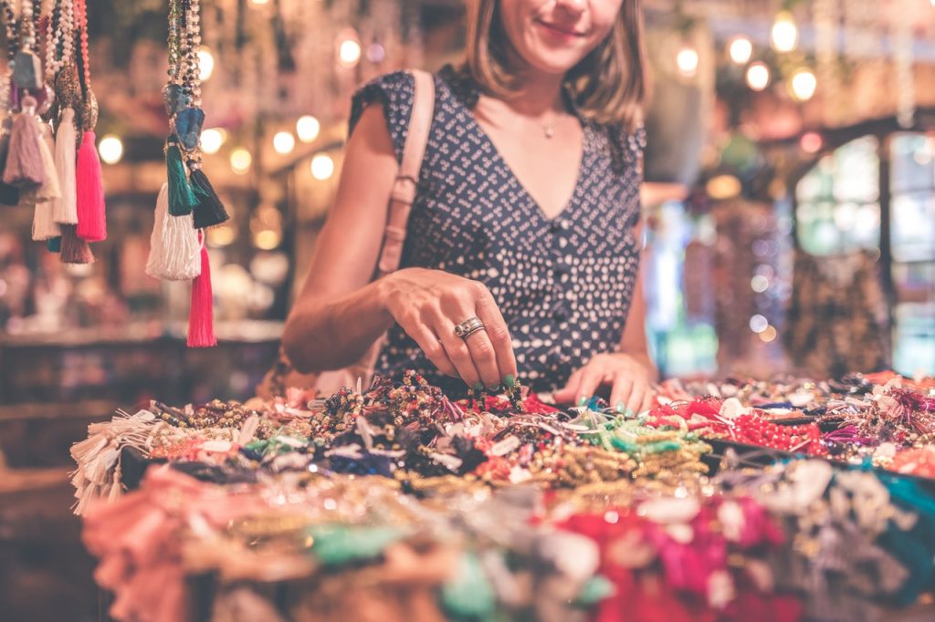 woman browsing jewelry at a botique